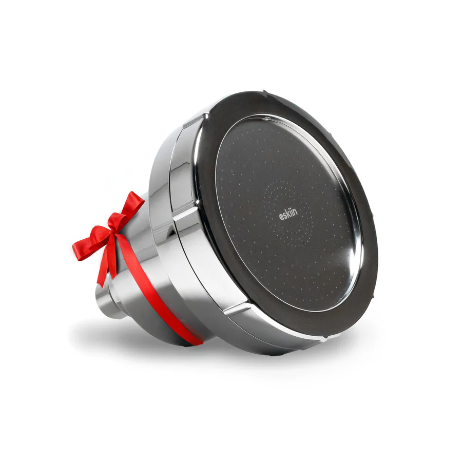 Shiny metallic kitchen appliance with a red ribbon bow.